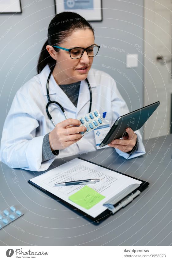 Female doctor doing online consultation showing pills for treatment online medical consultation female prescribing explaining med tech working tablet