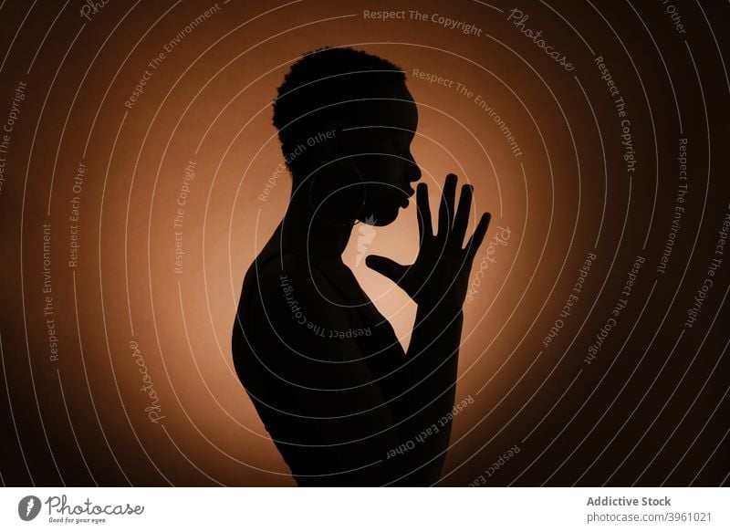 https://www.photocase.com/photos/3961021-unrecognizable-black-woman-praying-with-clasped-hands-photocase-stock-photo-large.jpeg