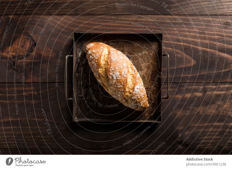 Loaf of fresh bread on baking tray loaf baked baking pan crispy food bakery whole rustic crust delicious nutrition tradition meal cuisine crunch natural cook