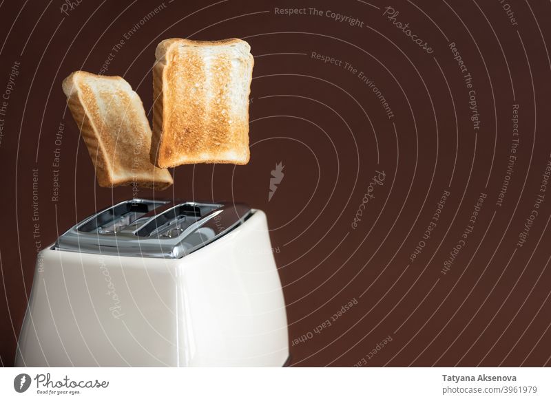 https://www.photocase.com/photos/3961979-slices-of-toast-jumping-out-of-the-toaster-bread-photocase-stock-photo-large.jpeg