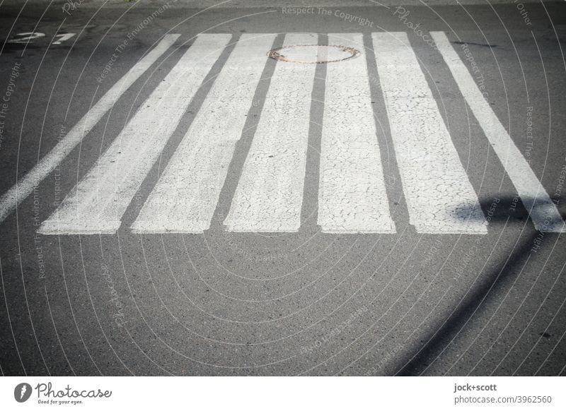 A zebra crossing between 21 and the street lights Street Zebra crossing Calm Structures and shapes Asphalt Symmetry Under Stripe Lane markings Arrangement Gully
