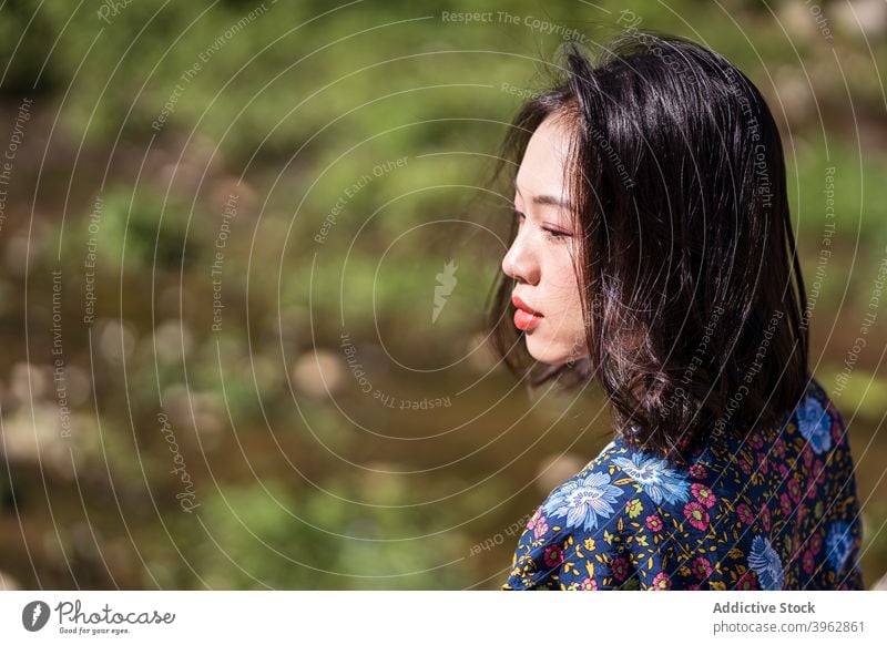 Asian woman in nature in summer calm tranquil sunny relax natural appearance beauty female asian ethnic taiwan peaceful daytime young rest enjoy harmony serene