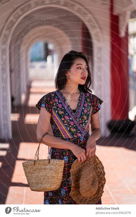 Cheerful ethnic woman standing in arched passage tourist sightseeing bridge archway smile traveler landmark female asian cikang overpass taiwan destination