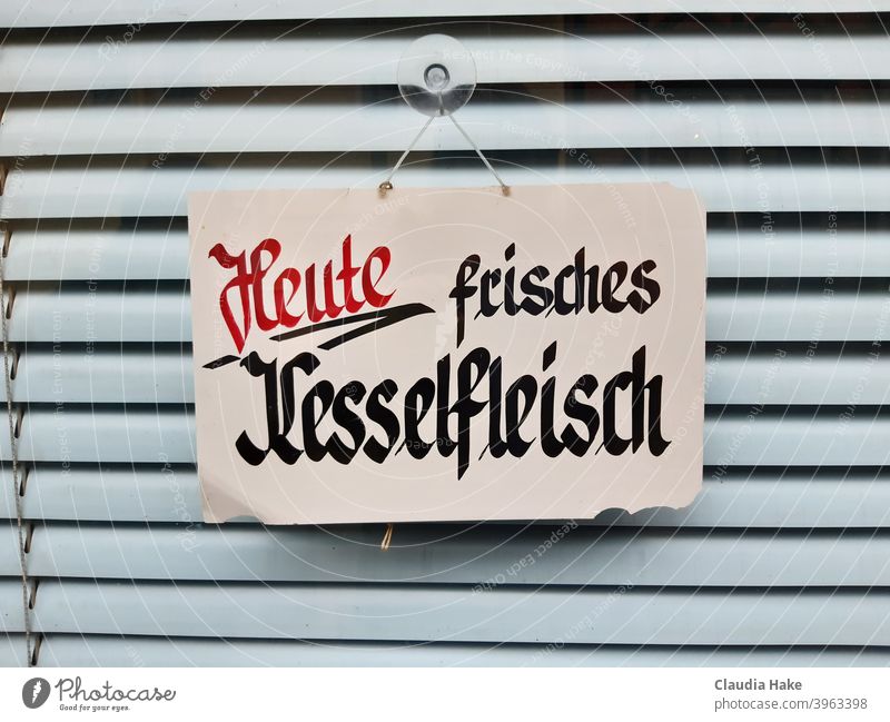 Handwritten sign "Today fresh Kesselfleisch" in the window of a closed butcher's shop Boiler Meat Butchery Closed Window Handwriting Roller blind