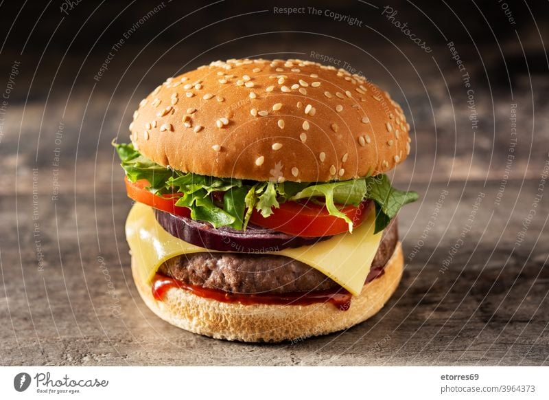 Cheeseburger with beef,tomato, lettuce and onion american barbecue bread cheese cheeseburger classic closeup delicious dinner fast food grilled hamburger