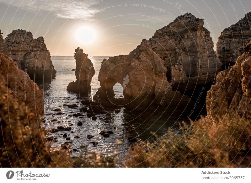 Waving water and cliffs at sunset sky nature bay evening algarve portugal sea rough harmony serene coast sundown peaceful picturesque scenic twilight cloudless