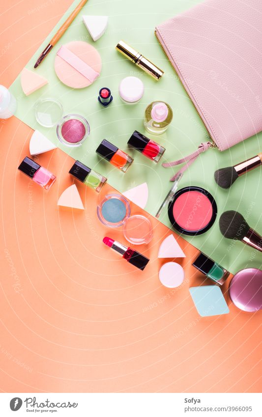 Make up accessories on orange and green. Flat lay make up flat lay beauty products fashion color pink cantaloupe woman mint design geometry face nail polish