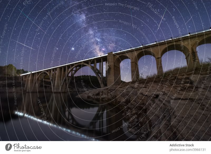 Viaduct under starry sky at night viaduct landscape bridge spectacular milky way galaxy dark glow illuminate light sparkle dusk astronomy scenic shiny luminous