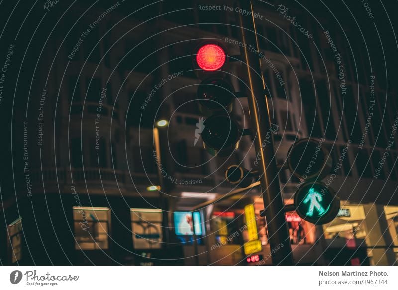 Low angle shot of a traffic light in the street at night. road urban yellow city landscape driving colours transport outdoors car travel blur dusk bokeh view