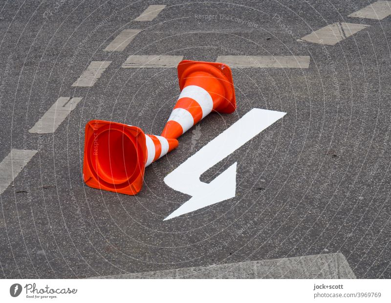 Guide cone guides around the freshly painted white arrow guiding cone Lane markings Arrow Traffic infrastructure Asphalt Street Direction Road sign Orientation