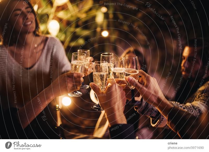 Group Of People Cheering And Celebrating With Champagne Glasses At Party Together A Royalty
