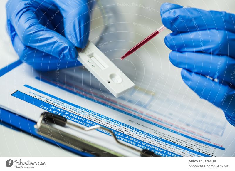Lab scientist performing rapid diagnostic test 2019-ncov analysis antibody antigen assay blood cassette cell convalescent corona coronavirus covid covid19