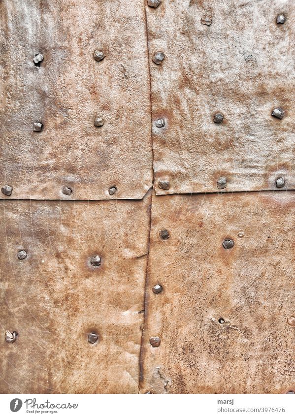 Contemporary history | 4 riveted, rusty metal panels that protect a door or facade from burglars and the weather Patchwork Craft (trade) mend Contrast Repaired