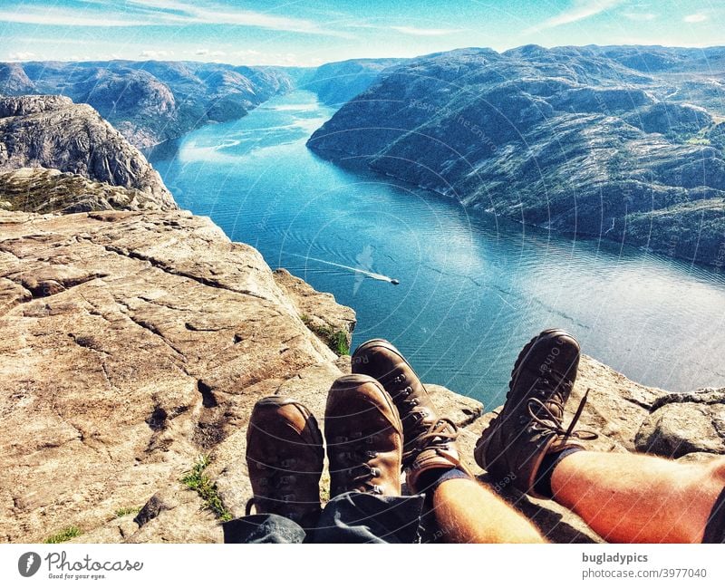 Rest your feet with a view over the Lysefjord Fjord fjord view Ocean Mountain Water Norway Scandinavia Vacation & Travel Sky Nature Landscape Rock Tourism