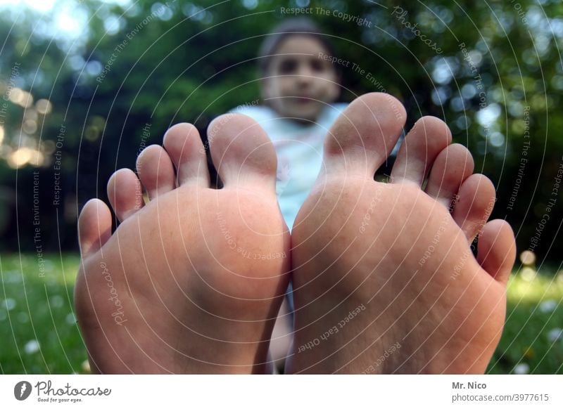 Bare dirty soles woman feet Stock Photo