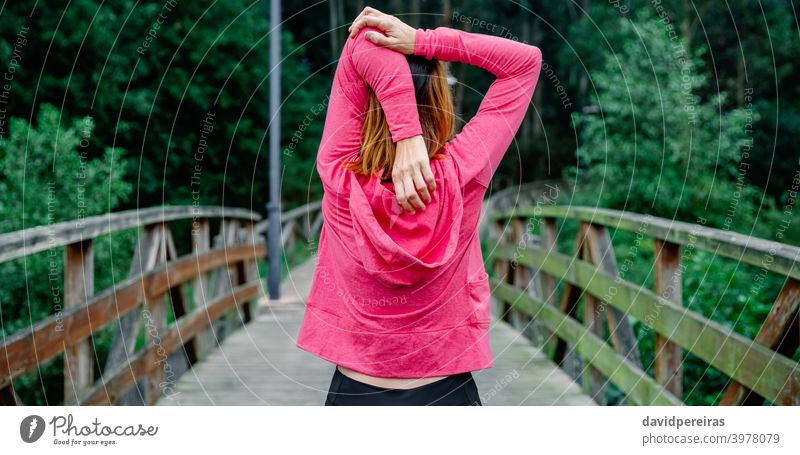 Unrecognizable Sportswoman Jumping Rope On A Bridge Stock Photo