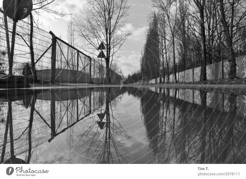 a big puddle in Mauerpark Berlin b/w wall park Prenzlauer Berg Puddle Black & white photo Town Deserted Exterior shot Capital city Downtown