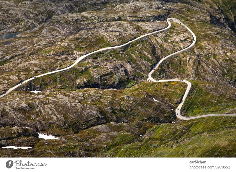 Road through rocky landscape in Norway Street Road traffic mountain road fjell Alpine Mountain Traffic infrastructure Transport curvaceous curves hairpin bend