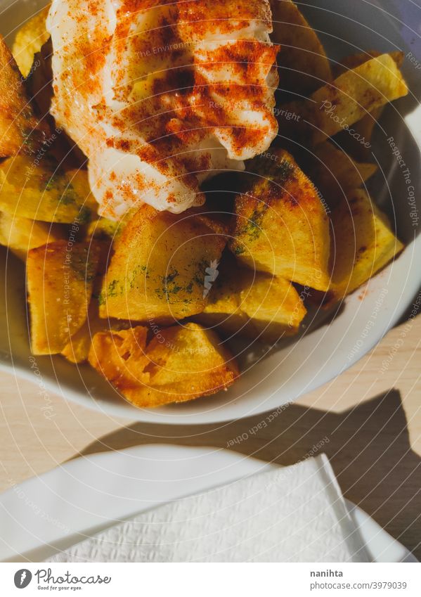 Patatas bravas with ajoaceite, Spanish tapa patatas bravas spicy potatoes delicious tasty spices terrace bar pub sun sunny spain spanish tapa recipe mayonnaise