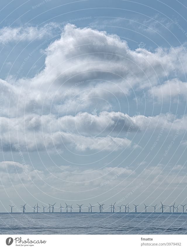 Clouds sea and wind turbines wind farm Pinwheel Wind energy plant eco-power Renewable energy Ocean Electricity Alternative Energy Environmental protection Rotor