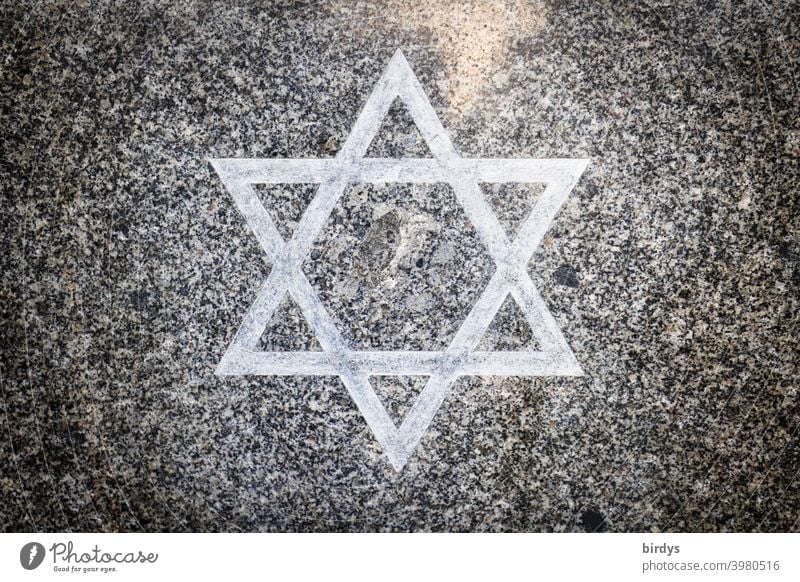 Star of David on a granite stone slab. Judaism , hexagram symbol with religious meaning.central perspective Religion and faith Jewish faith Granite Granite slab