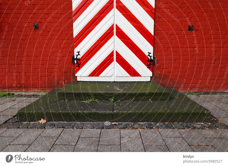 Antique entrance door in red and white with steps in front. Medieval door, red brick wall Old medieval Reddish white Striped Diagonal stagger Entrance