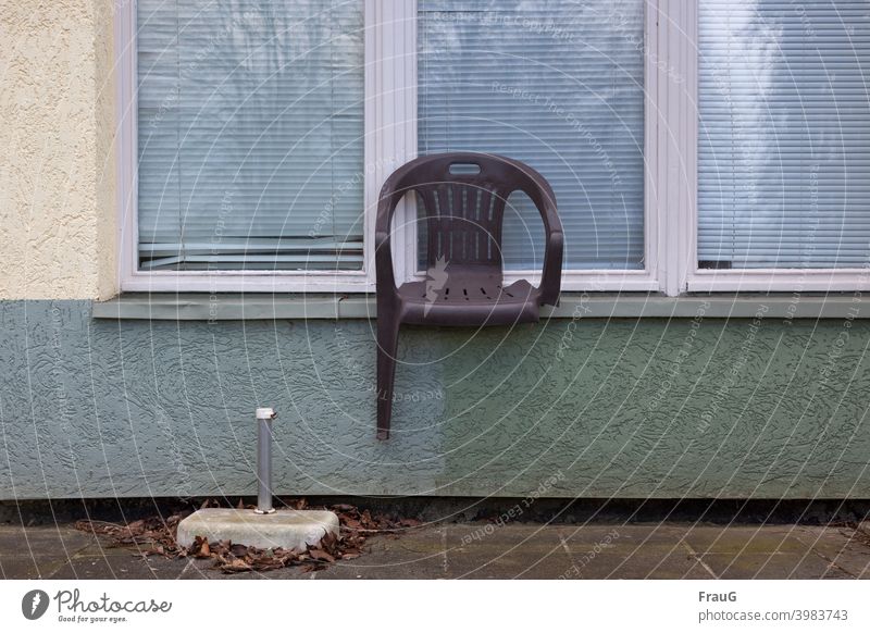 a broken chair on the windowsill House (Residential Structure) Rendered facade Facade Window blinds reflection Chair Garden chair stacking chair Plastic