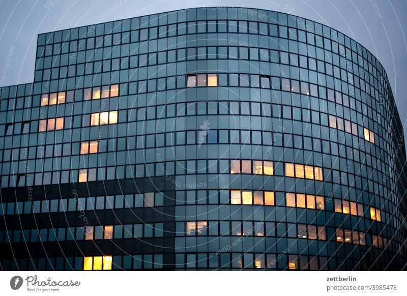 Facade with single illuminated windows Structural engineering Evening Architecture construction industry Construction site Berlin Office city Germany Twilight