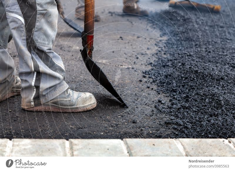 Hard work during the asphalting of a new road Construction worker Street construction Road construction Heavy Heavy industry Industry construction works Hot
