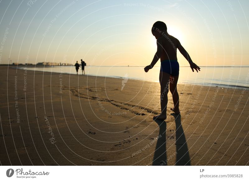 silhouette of happy child on the shore of the ocean at sunset dancing Faith & Religion background Forward Arm Hand Contentment Dance Posture Vacation & Travel