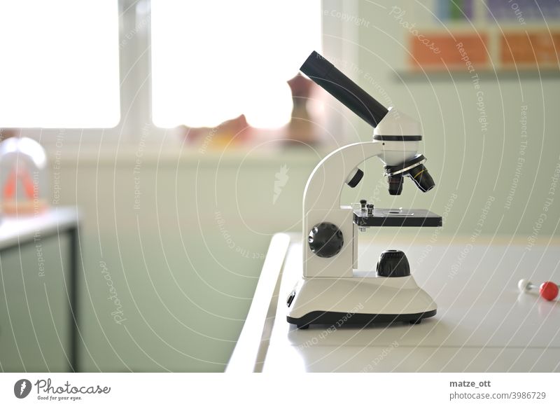 A microscope on a lab bench. Laboratory Microscope School university investigation Science & Research medicine Pharmaceutics test research Lessons Chemistry