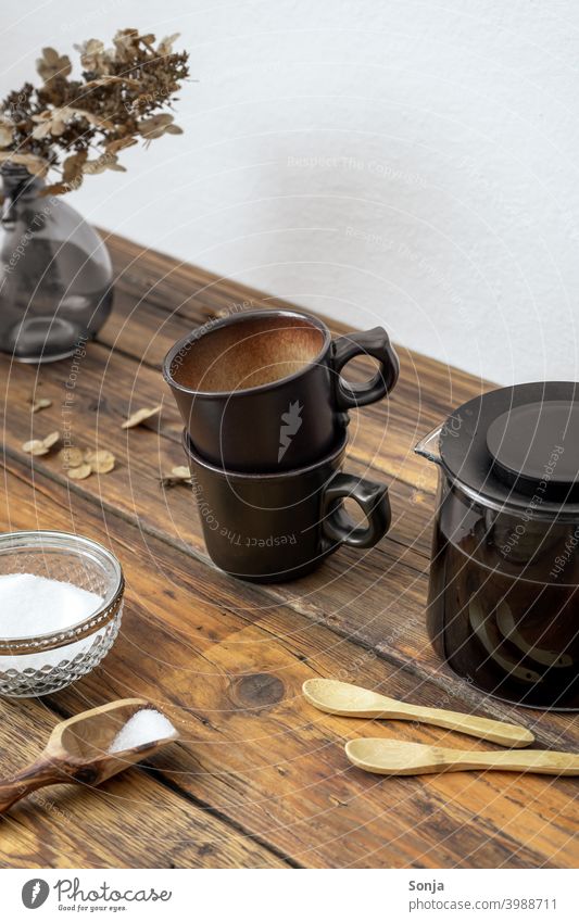 Two coffee cups and a coffee pot on a rustic wooden table two Coffee break Coffee pot Espresso Beverage Cup Breakfast Wooden table Rustic at home Caffeine