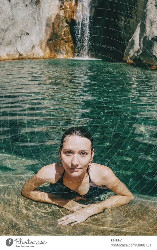 girl in the water in a waterfall in sadernes peaceful human perfect pure relaxing skin person enjoying paradise alternative happiness one person lady quiet