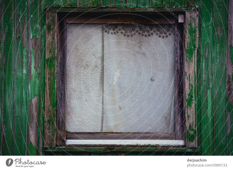 Old window with drawn curtains, which are slightly dirty, with small dark border. The outer frame is dark to light green. Curtain Deserted Colour photo Window