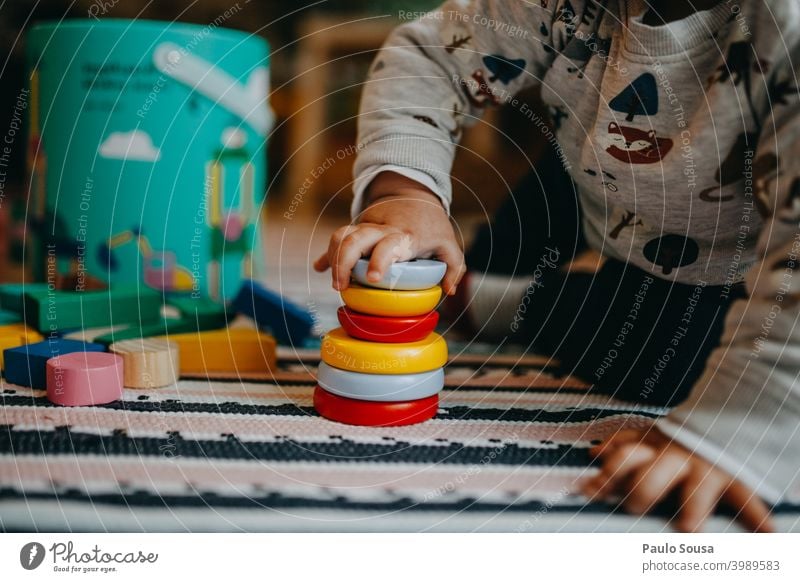Toddler playing with wooden toy Toys Kindergarten Authentic at home Human being Joy Infancy Playing Child Happy Cute preschooler Action Creativity Multicoloured