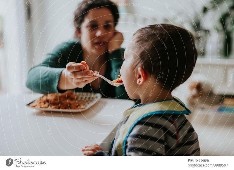 Mother feeding child motherhood Together togetherness Child care Caucasian Happiness people Infancy Woman Hold Joy Family & Relations Happy Lifestyle Love