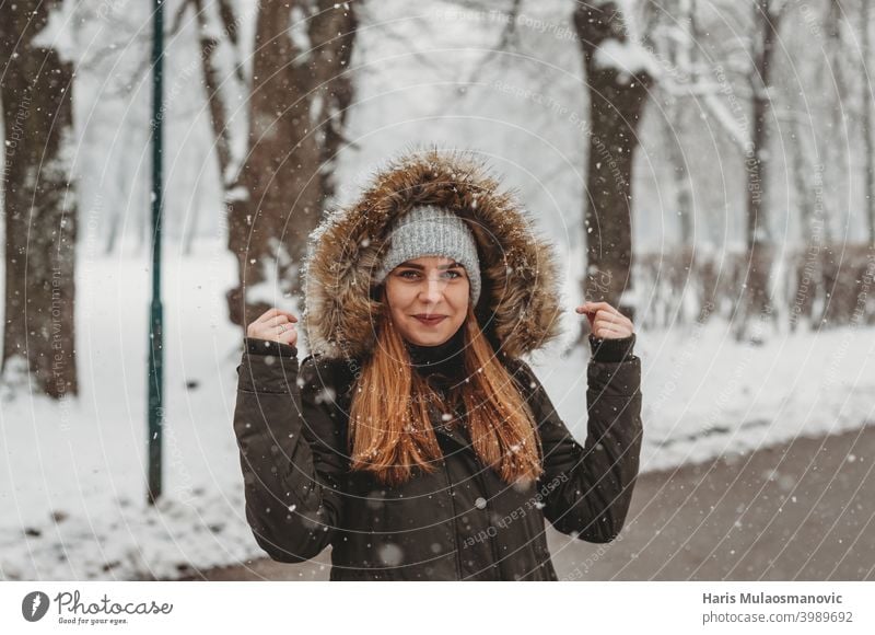 happy woman outside on the snow attractive background beautiful cold female fun girl happiness hat holiday joy lifestyle nature outdoor park people person
