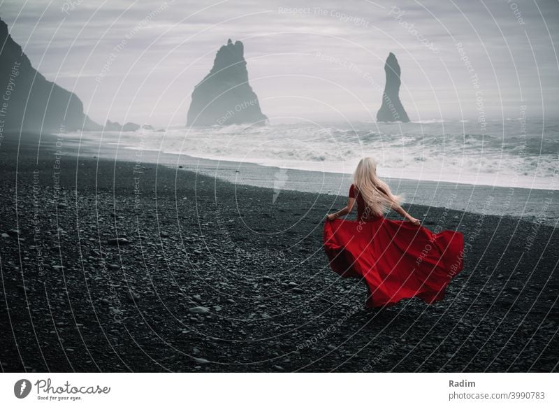 Reynisdrangar beach with red dressed woman Dressed dressed in red ocean Atlantic Elegant Clothing Style Human being Lifestyle Fashion Hip & trendy Model Suit
