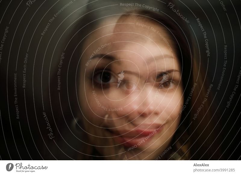 Double Exposure Portrait Of A Young Brunette Woman Smiling In Both