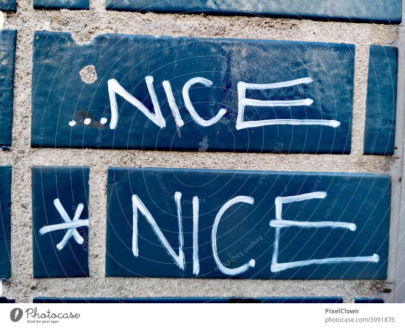 Graffiti, nice is always good Blue Wall (building) Colour photo Characters Street art Youth culture Word Daub Letters (alphabet) Subculture Trashy