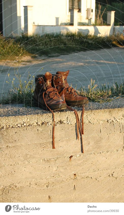 sunbath Footwear Hiking boots Break Wall (barrier) Sunset Europe Corfu