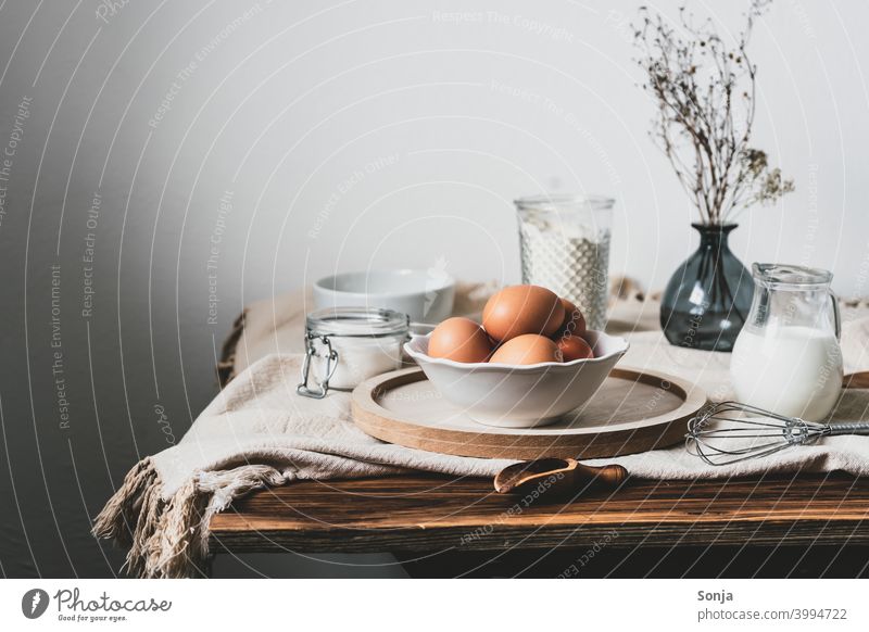 eggs in a bowl and baking ingredients on a linen tableclotheinem Linen cloth Ingredients Baking Still Life Breakfast Table Wood Rustic Wall (building)