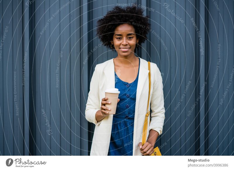 African American business woman standing in front of her team in office - a  Royalty Free Stock Photo from Photocase