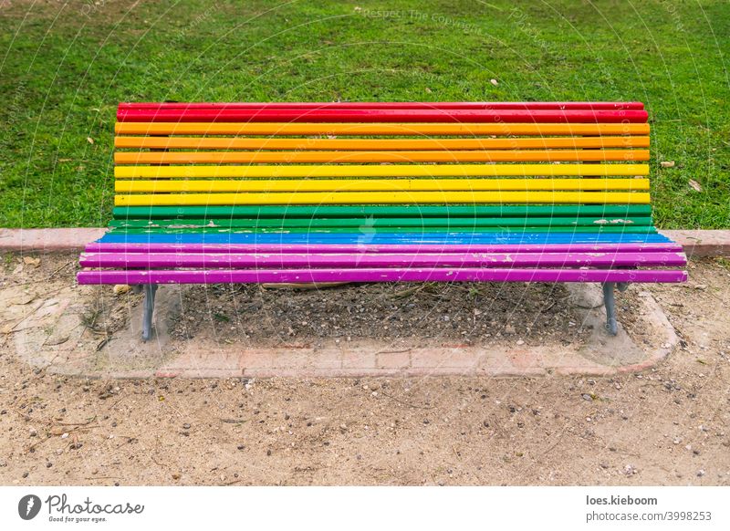 Colorful lgbt rainbow painted bench in a park in Valencia, Spain icon love pattern vintage banner colorful pride flag lesbian community homosexual transgender
