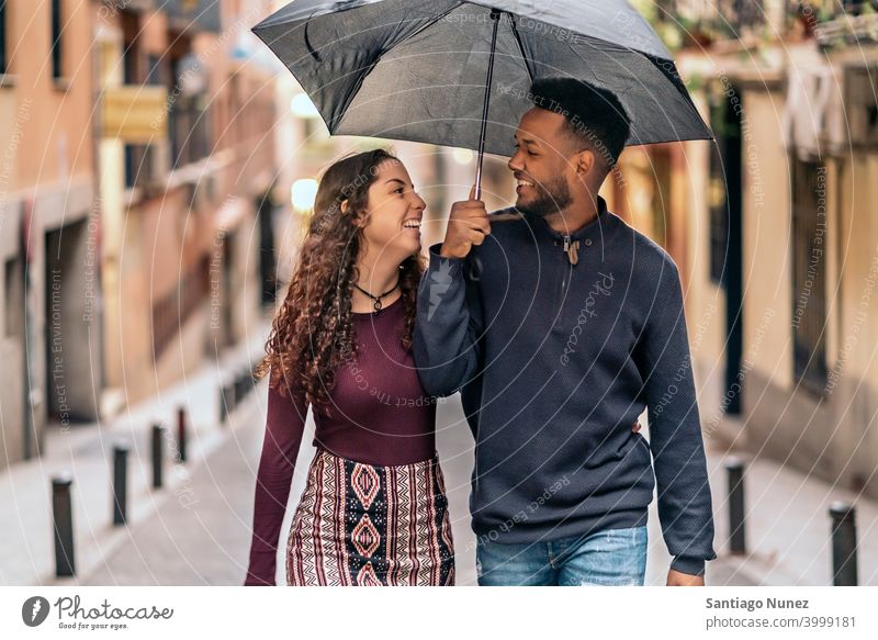 Interracial Couple Having Fun street interracial couple black afro african american diversity relationship multi-racial black man ethnic multi-cultural