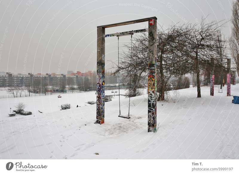 Swings in the Winter Wall Park Berlin Prenzlauer Berg wall park Snow Colour photo Town Exterior shot Downtown Capital city Old town Deserted Day cold