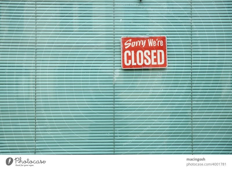 Shop window with green blind and CLOSED sign lockdown closing time closing hours Green Venetian blinds Store premises Gastronomy Sorry we're closed Signage