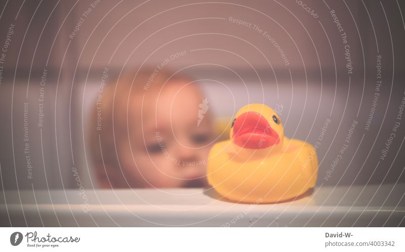 Child , squeaking duck and bathtub Squeak duck bathe Bathtub squeaky duck bathing day Sunday Cute Duck Infancy