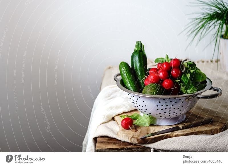Raw radishes and green vegetables in a colander on a kitchen table Vegetable Green Radish Still Life Kitchen Table Rural Vegetarian diet Healthy Eating