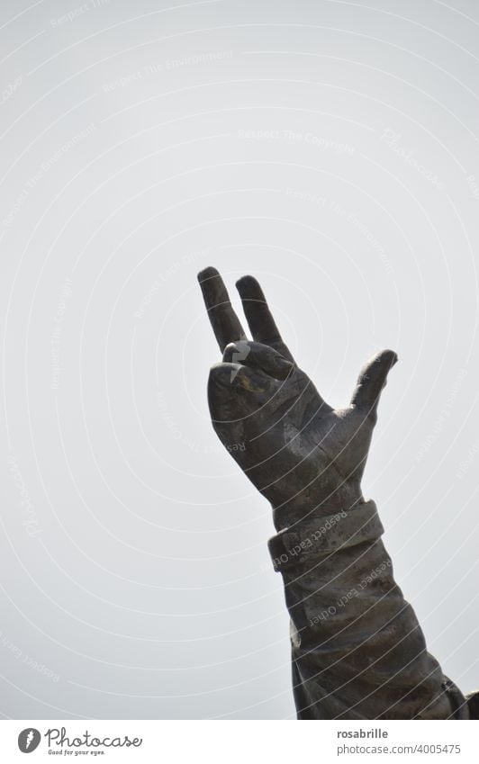 Hand of a statue points to the sky | Contemporary History Sign language gesture Gesture Communicate Direction Forefinger Fingers portion arm open space